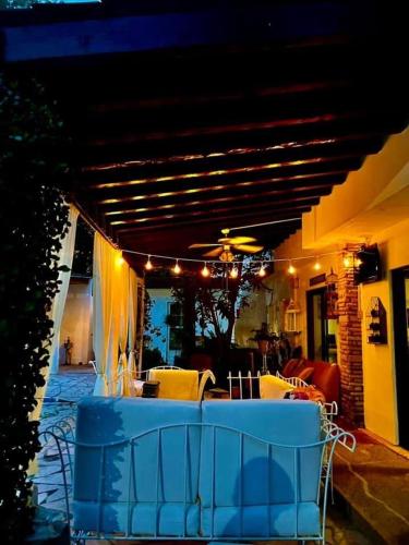 a patio with a table and chairs in a house at La Casita Inn Bustamante in Bustamante