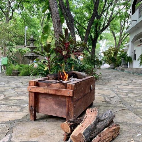 a wooden box with plants in it on a patio at La Casita Inn Bustamante in Bustamante