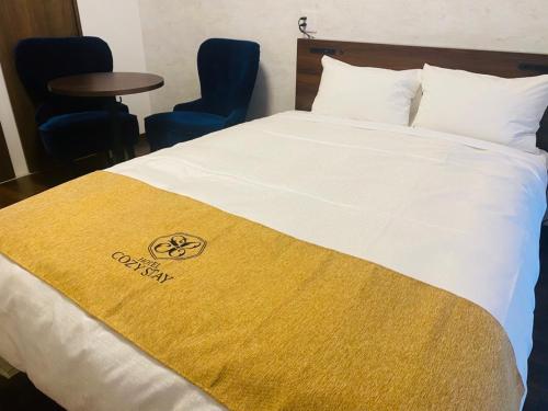 Postel nebo postele na pokoji v ubytování HOTEL Y'RISE TO URASOE