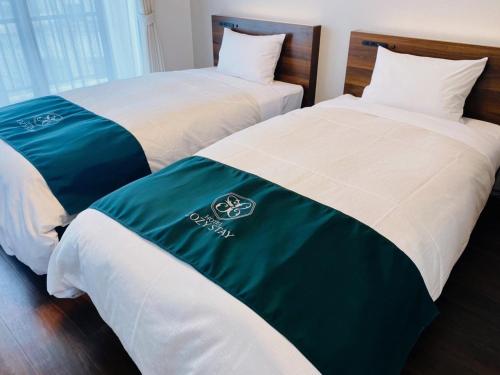 Postel nebo postele na pokoji v ubytování HOTEL Y'RISE TO URASOE