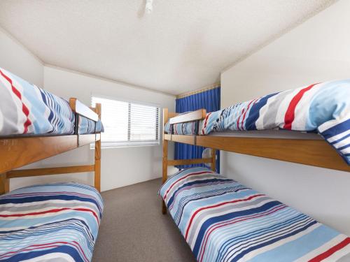 Ένα ή περισσότερα κρεβάτια σε δωμάτιο στο Centrepoint 10