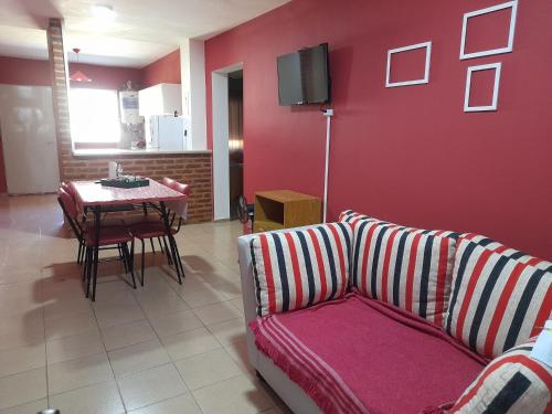 a living room with a couch and a table at Departamento céntrico en San Pedro in San Pedro