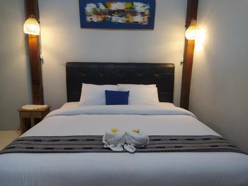 Cama o camas de una habitación en Bata Merah Homestay