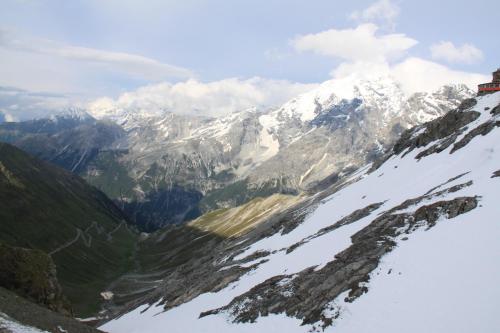 a view of a mountain range with snow on it at Hotel Genziana in Passo Stelvio