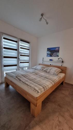 Gemütliche Ferienwohnung Reinsfeld tesisinde bir odada yatak veya yataklar