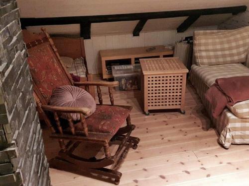 a room with two chairs and a couch and a table at 6 person holiday home in Fonnes-By Traum in Fonnes