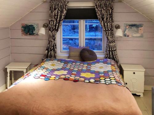 a bed in a room with a window at 6 person holiday home in Fonnes-By Traum in Fonnes