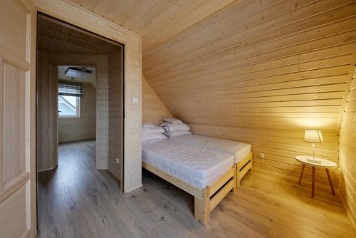 Ένα ή περισσότερα κρεβάτια σε δωμάτιο στο Lubaczówka