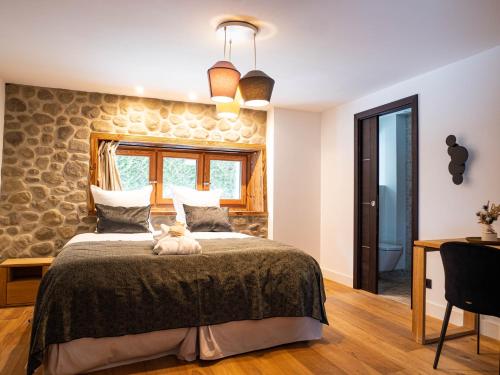 a bedroom with a bed with a dog sitting on it at Chalet Bonami - Chalet de Prestige à Chamonix in Chamonix