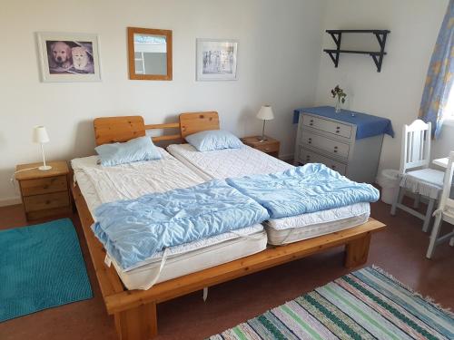 A bed or beds in a room at Furudals Vandrarhem och Sjöcamping