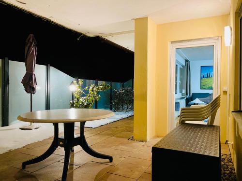 a table and a chair in a room at Haus Jenni im Schwarzwald, 3,5-Zimmer, große Terrasse in Freudenstadt