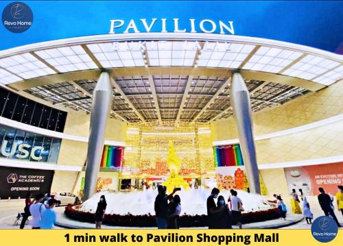 a poster of a shopping mall with people walking around it at Revo Home at Pavilion Bukit Jalil in Kuala Lumpur