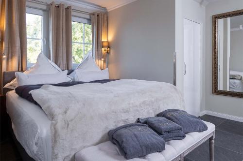 Ένα ή περισσότερα κρεβάτια σε δωμάτιο στο Luxus Resort Rügen Residenz Kubitzer Bodden