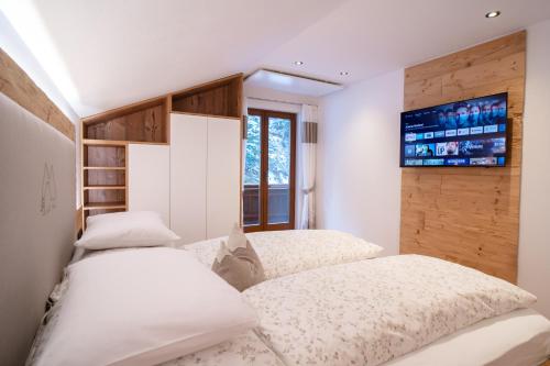 Postel nebo postele na pokoji v ubytování Ferienhaus Leite Häusl