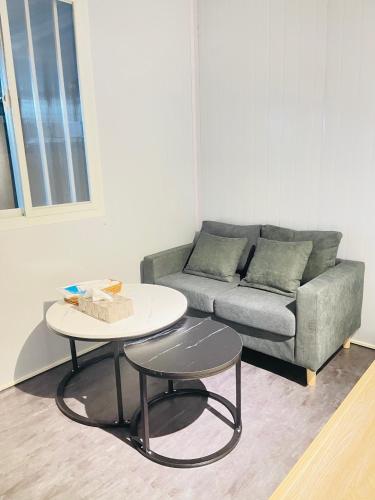 a living room with a couch and a table at 東澳海安獨木舟旅人驛站 in Suao
