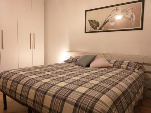 A bed or beds in a room at Casa di Gabry