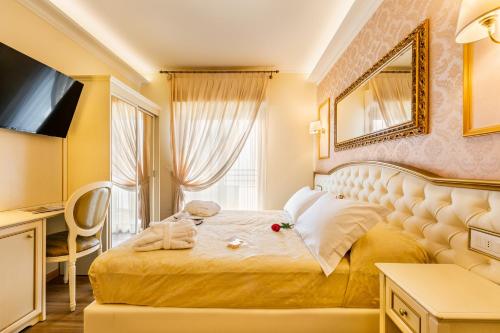 Postel nebo postele na pokoji v ubytování Hotel Mazzanti