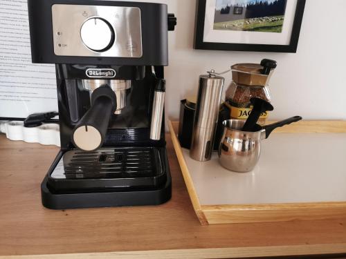 a coffee maker sitting on top of a counter at Nad Potokiem z Alpakami in Stronie Śląskie