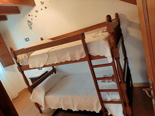 Postel nebo postele na pokoji v ubytování Viviendas vacacionales La Casona de Tresniñin