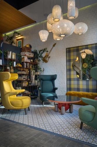 a room with chairs and a table in a store at Hotel Mirador de Chamartín in Madrid