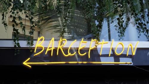 a neon sign in the window of a building at Comfort Hotel Malmö in Malmö