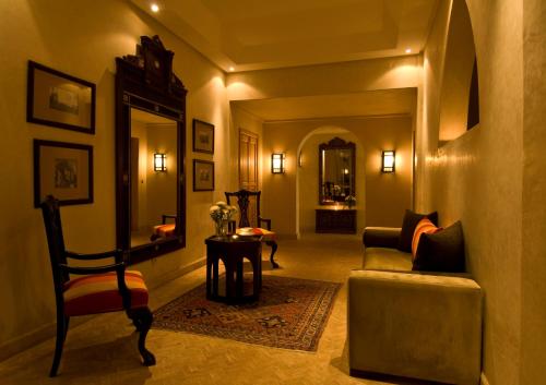 a living room with a couch and a chair at Le Riad Villa Blanche in Agadir