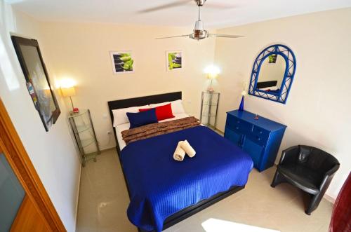A bed or beds in a room at Ferienwohnung PLAYA - Pool - 50 m Strand - Meerblick - WiFi
