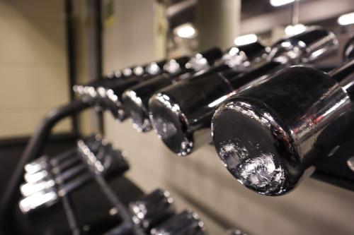 a row of black benches with water dripping from them at Comfort Hotel Malmö in Malmö