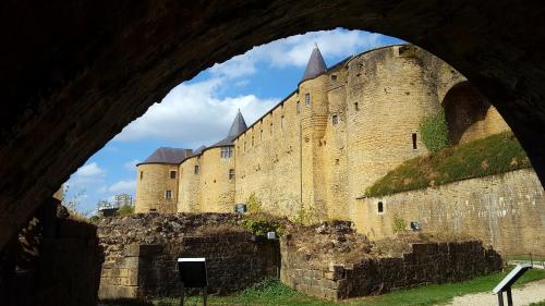 a view of a castle from under a bridge at Gîte des trois vallees in Nouzonville