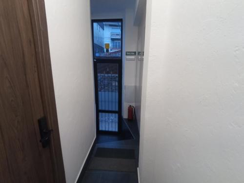 a hallway with a stairway leading into a building at Apartamento de lujo en la Sierra in Becerril de la Sierra