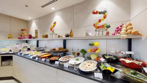 a buffet line with many different types of food at Ayass Hotel in Amman