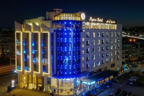 a building with blue lights on top of it at Ayass Hotel in Amman
