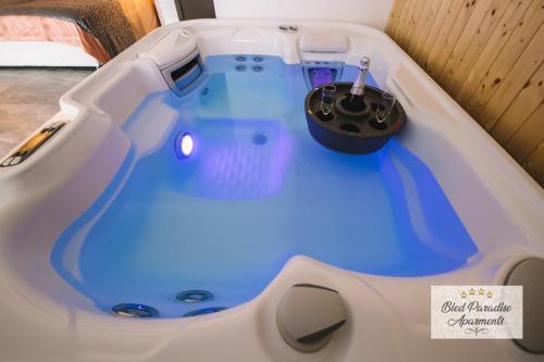 a jacuzzi tub with a toothbrush in it at Wellness Paradise Apartment in Bled