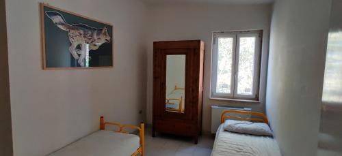 a small room with a bed and a window at Casa Vacanze Varuga in Praia a Mare