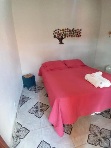 Ένα ή περισσότερα κρεβάτια σε δωμάτιο στο Hospedaria de Maria