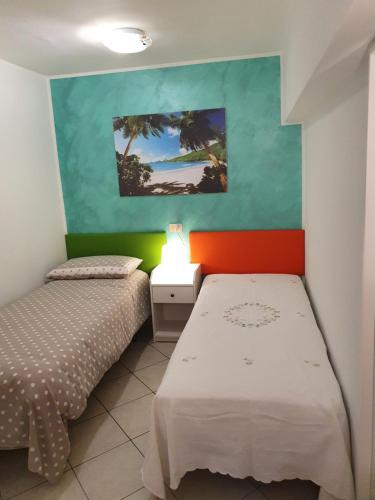 Postel nebo postele na pokoji v ubytování Casa dell'ape Maia