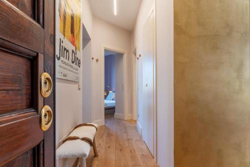 a hallway with a room with a bed and a door at HospitalityRome Testaccio Apartment Tiber View in Rome