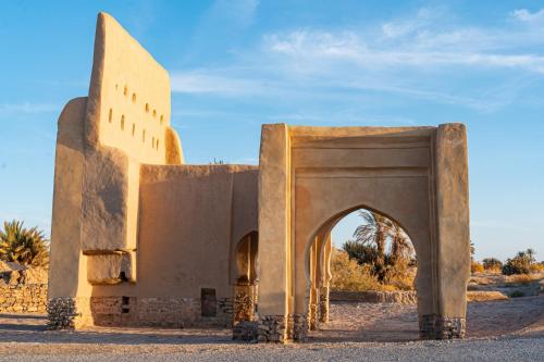an entrance to a building in the desert at Kasbah Hotel Ziz Palace Rissani in Rissani