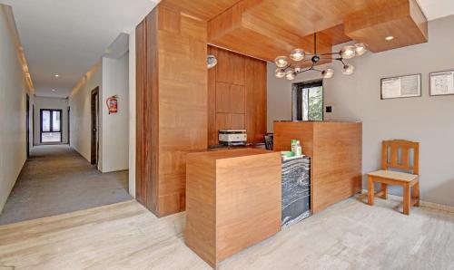 a kitchen with wood paneling and a counter top at Itsy Hotels Shivshakti in Aurangabad
