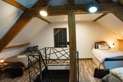 Tempat tidur dalam kamar di Maison d'hôtes à la Ferme Une Pause à la Guette