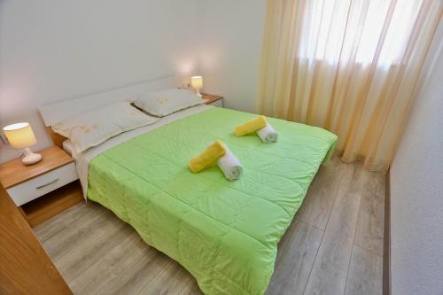 Postel nebo postele na pokoji v ubytování Apartments Lenka