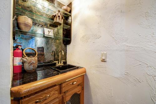 a kitchen with a sink and a counter top at Cabin on a Hill in Idyllwild