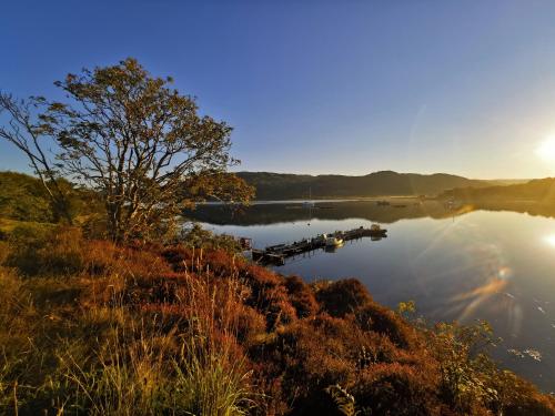 a view of a lake with a boat in the water at Kelpie in Lochgilphead