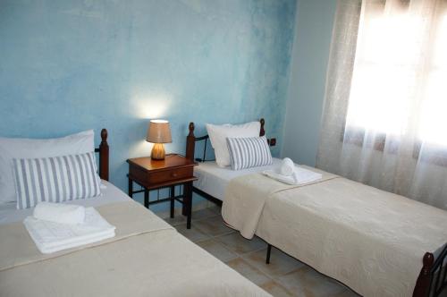 Postel nebo postele na pokoji v ubytování Mani Villas