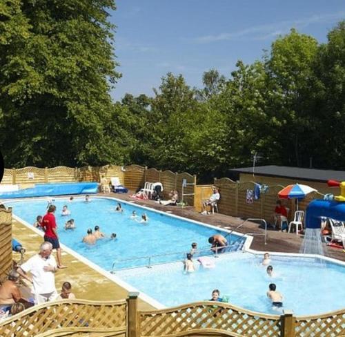 a group of people in a swimming pool at Home from home in Hastings