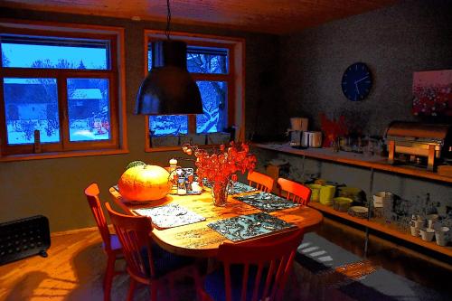 a dining room table with a pumpkin on it at Pilava in Roja