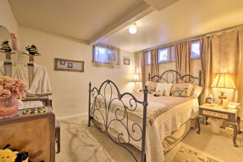 a bedroom with a bed with a wrought iron bed frame at Cozy and Vintage Cedar City Apartment with Fire Pit! in Cedar City
