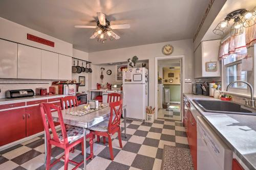 a kitchen with a table and chairs and a refrigerator at Charming Cedar City Retreat - Walk to Downtown! in Cedar City