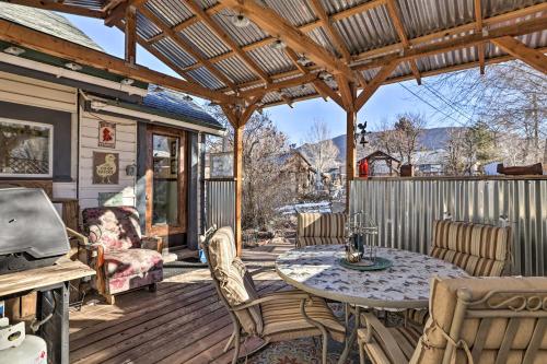 a patio with a table and chairs on a deck at Charming Cedar City Retreat - Walk to Downtown! in Cedar City