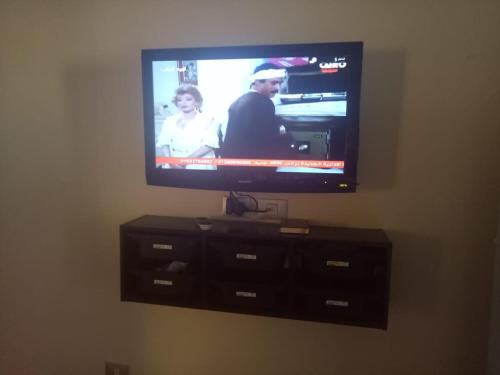 a flat screen tv sitting on top of a dresser at One Bedroom Chalet at Porto South Beach Families only in Ain Sokhna